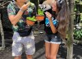 Dua wisatawan memberi makan koala di Bali Zoo Park